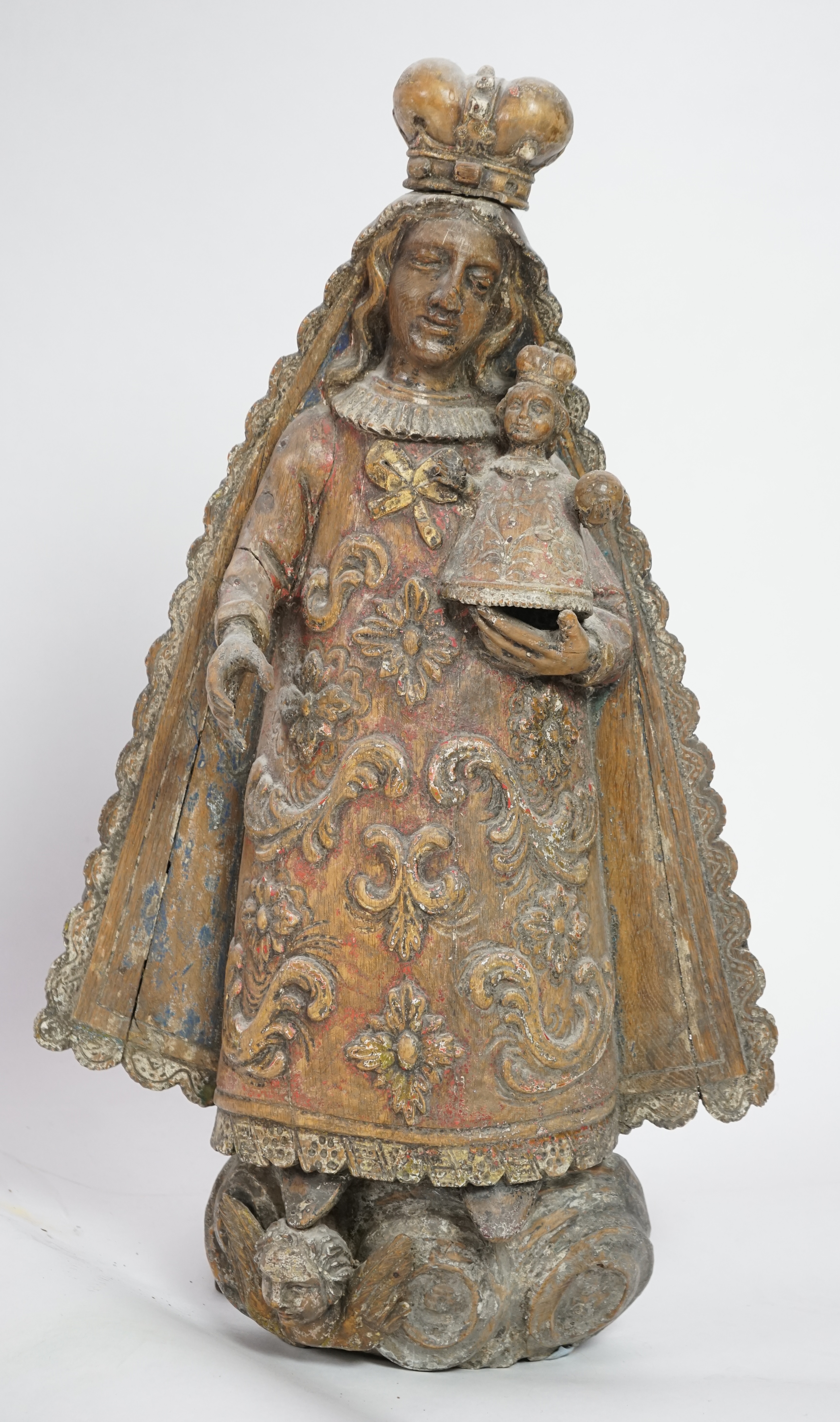 A late 18th century Spanish polychrome oak group of the Madonna and child